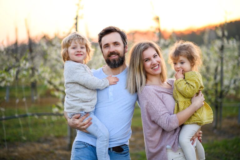 family-with-two-small-children-standing-outdoors-i-2023-11-27-05-04-57-utc (1)